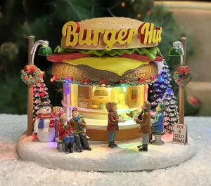 MOMENTS IN TIME Christmas Village Building, Burger Shop with LED Lights and Christmas Music - Battery Operated (not Included) (7.2" H x 9.6" W x 8.0" D)